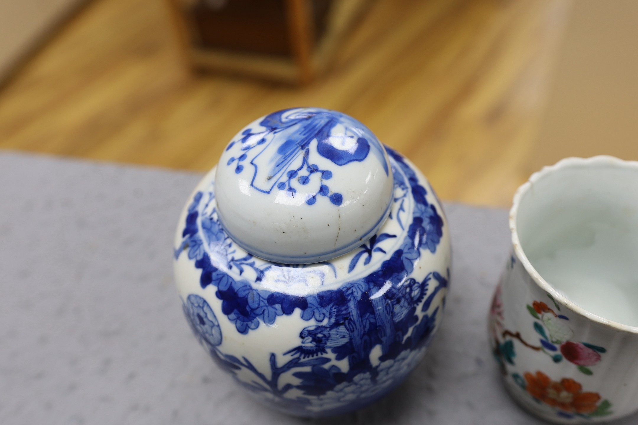 A Chinese blue and white jar and cover, Kangxi mark late 19th century and an 18th century Chinese famille rose mug. 15.5cm high